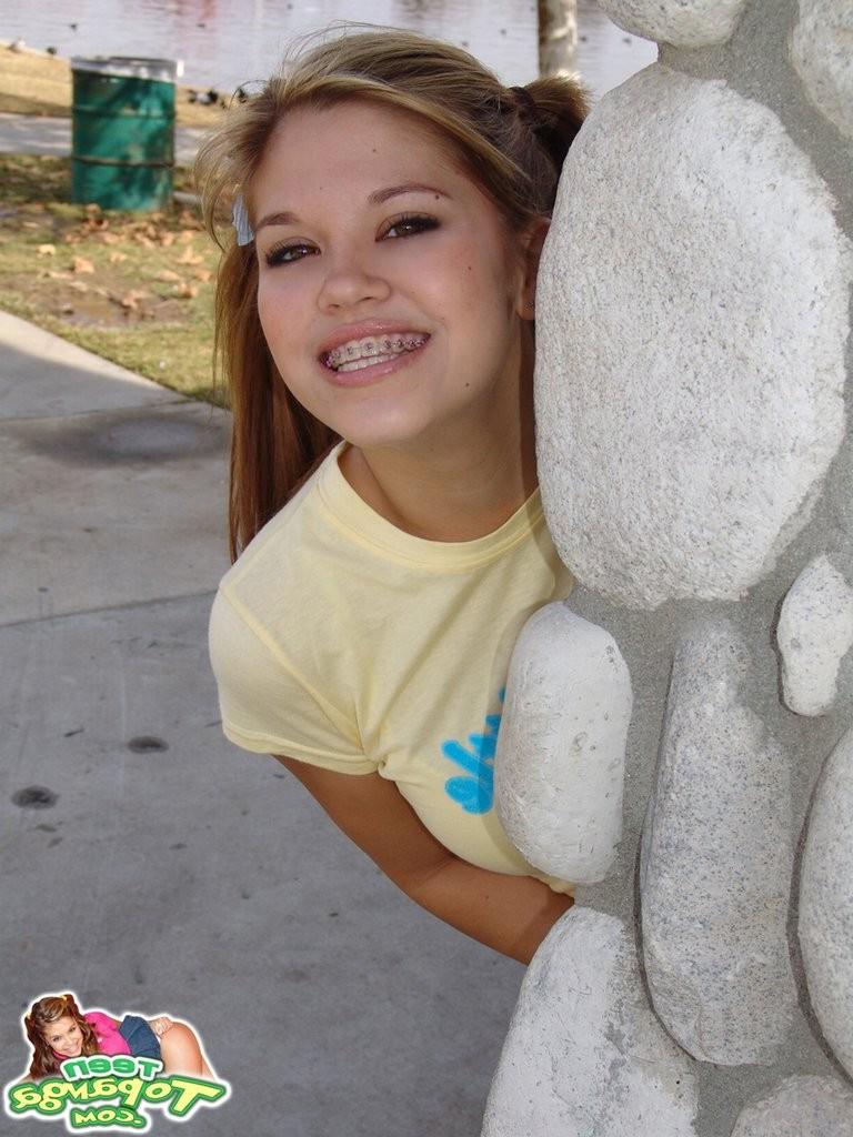16P Upskirt panty view on a cute teen girl outdoors