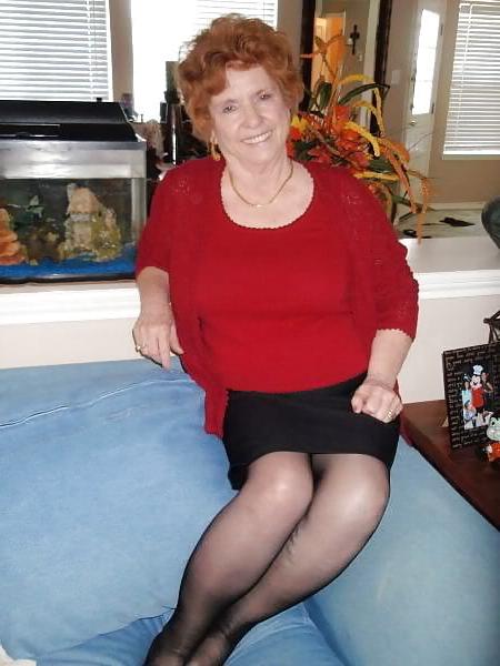 13P Non-nude Beautiful smiling granny redhead