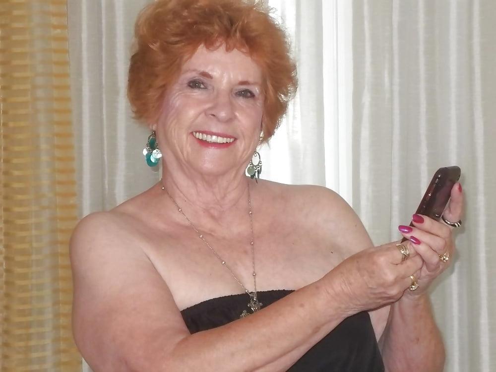 13P Non-nude Beautiful smiling granny redhead