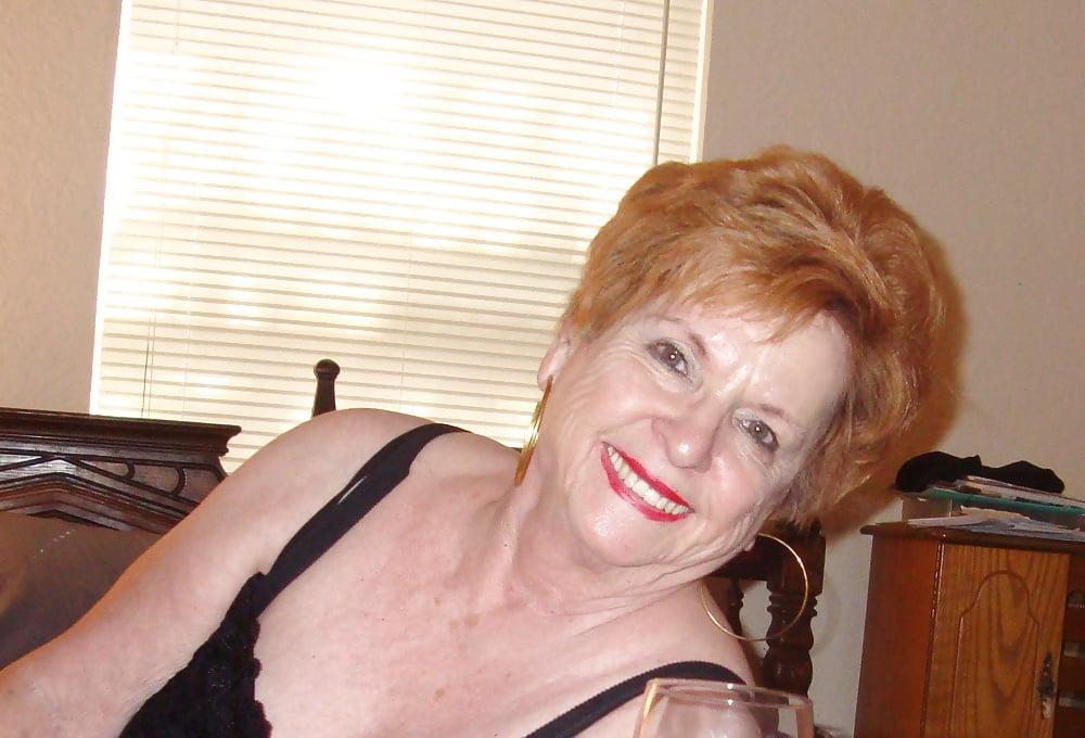 13P Non-nude Beautiful smiling granny redhead
