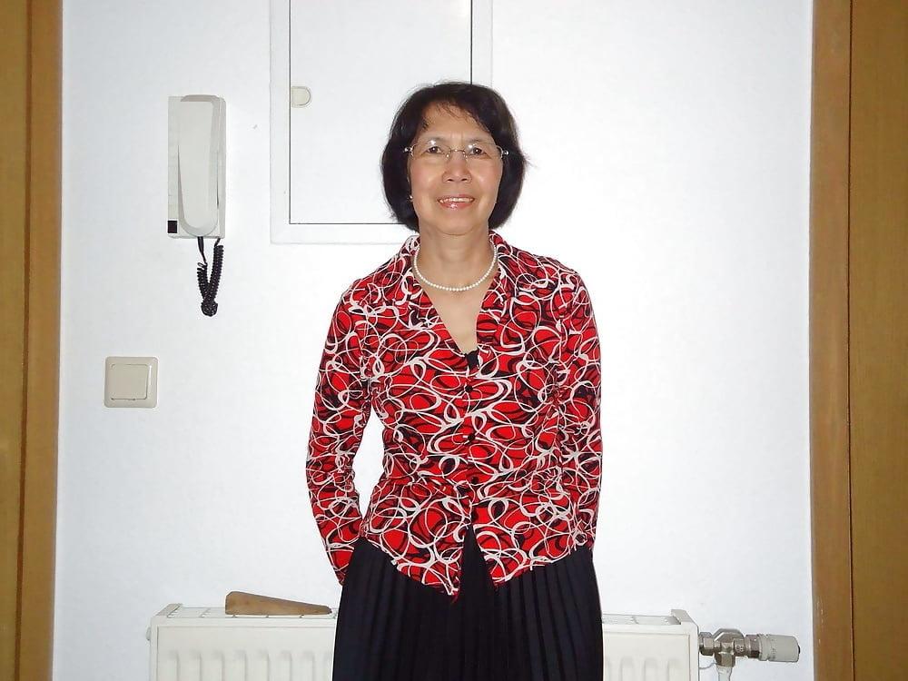21P Beautiful non-nude asian granny posing
