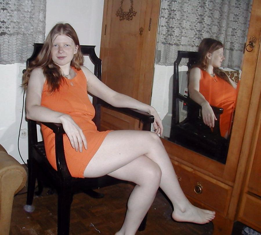 25P Redhead fingering and fondling herself