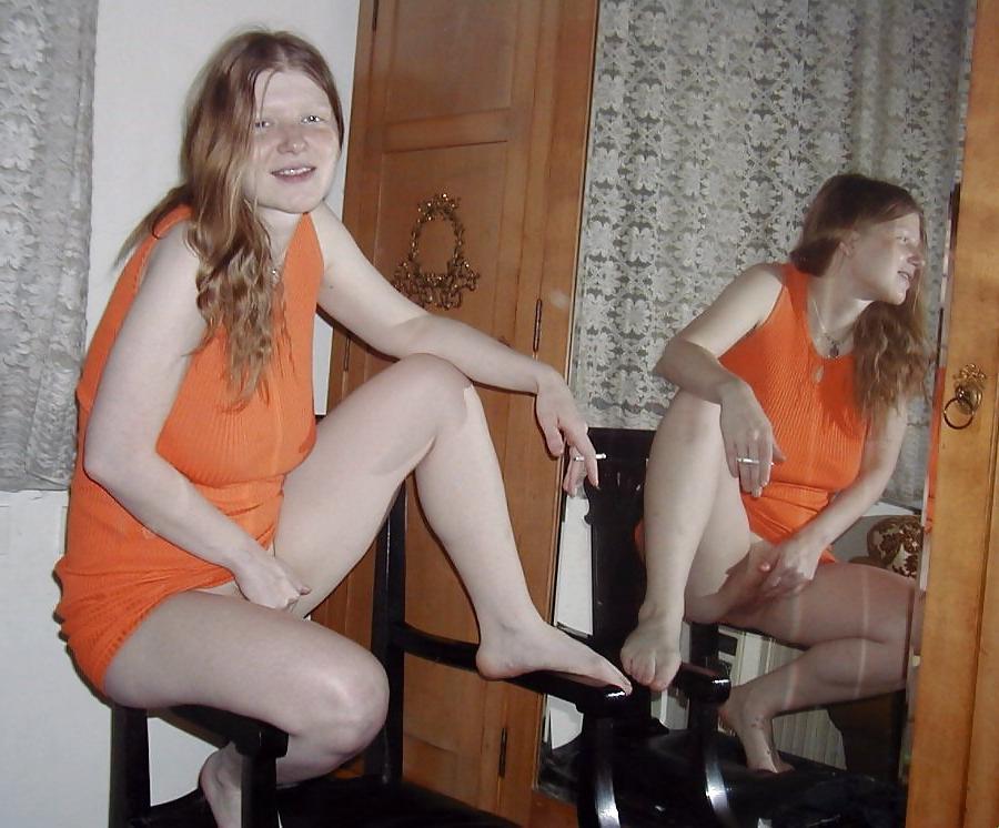 25P Redhead fingering and fondling herself