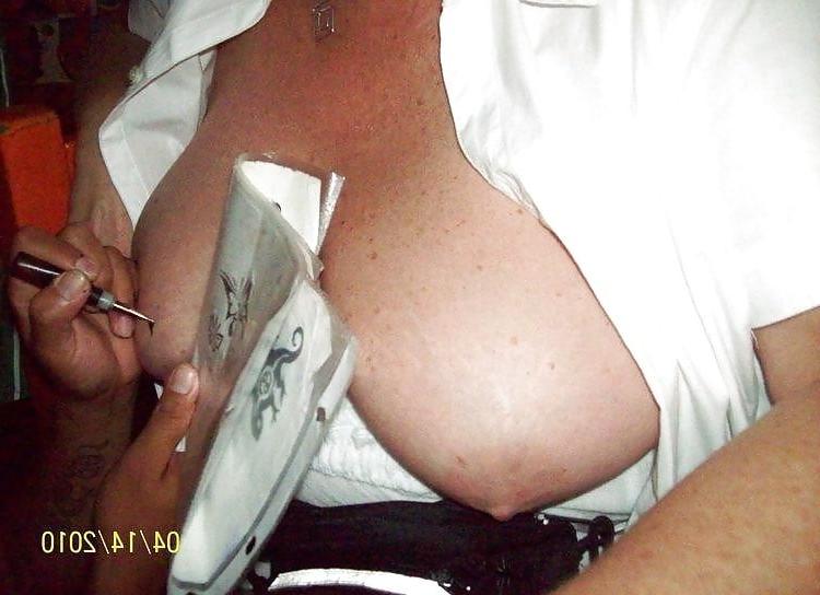 7P D.r.u.n.k granny gets a tattoo on her tit