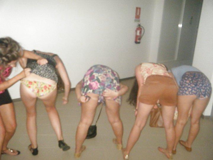 19P Girls pulling friends skirts up