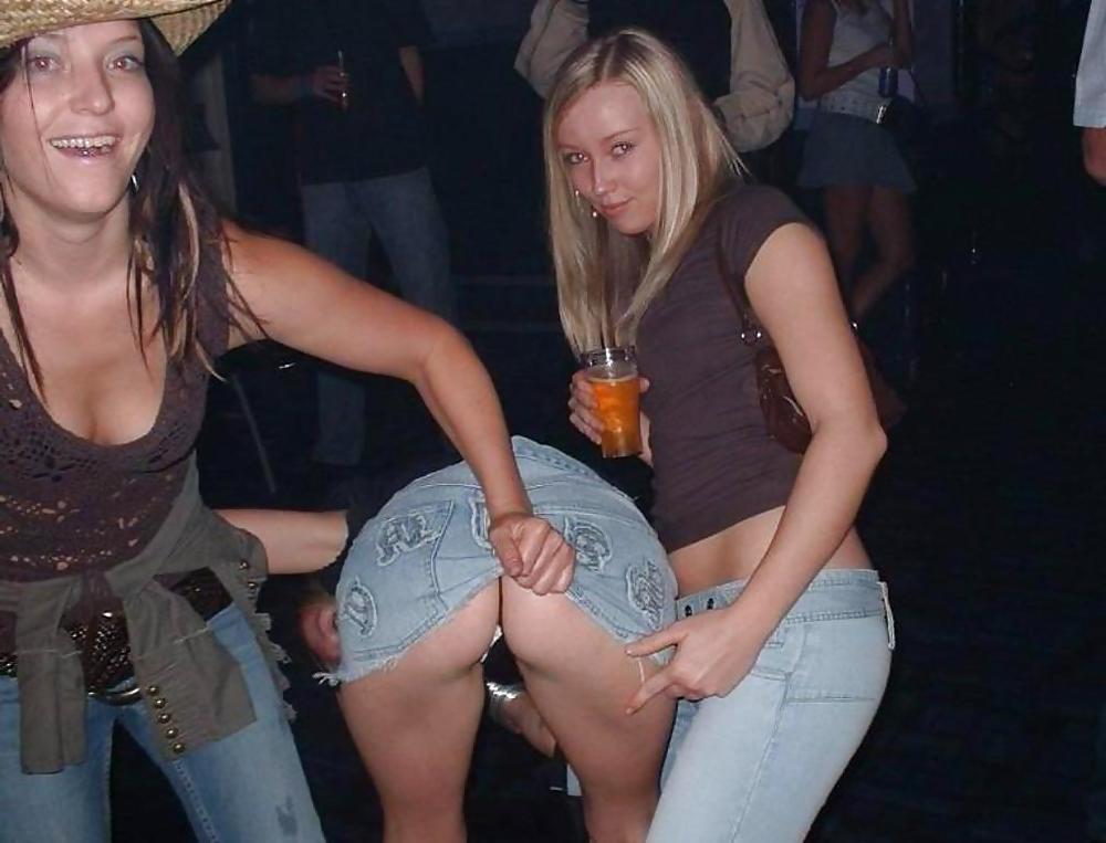 19P Girls pulling friends skirts up