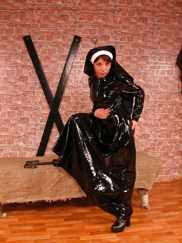15P A latex nun punishing a girl