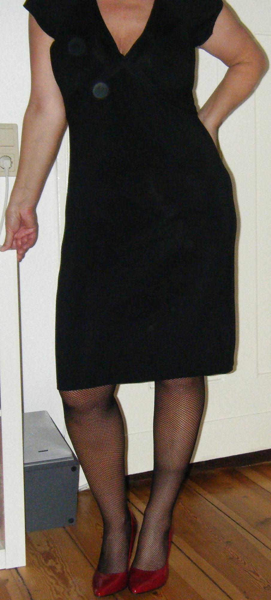 10P Black Fishnet Stockings in Red Highheels and a Shaved Pussy