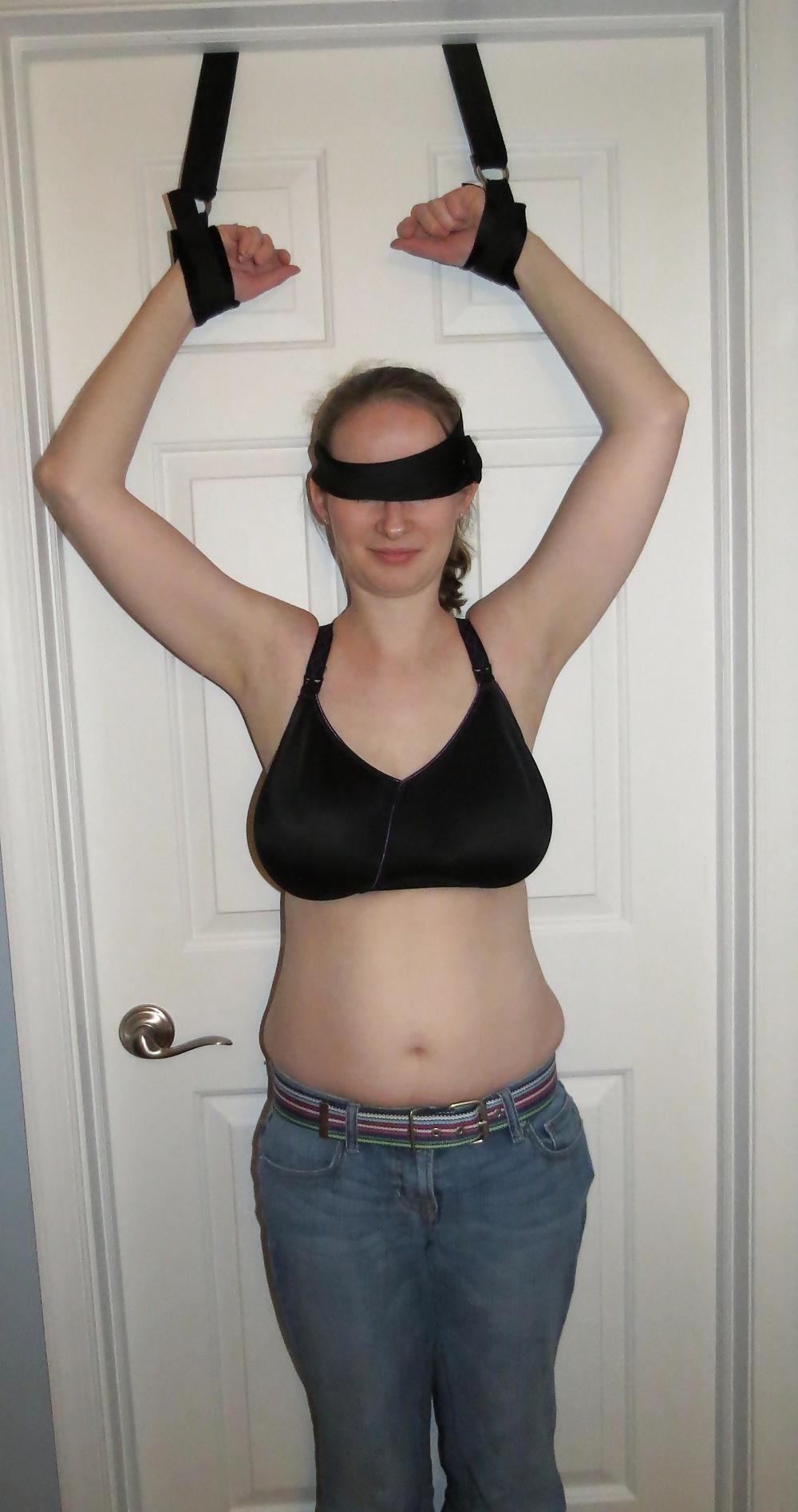 9P Wife blindfolded, topless, and bound to door