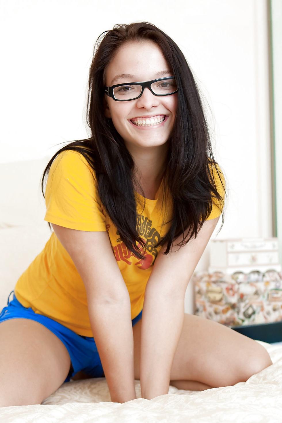 8P Girl in glasses fingers her pussy.