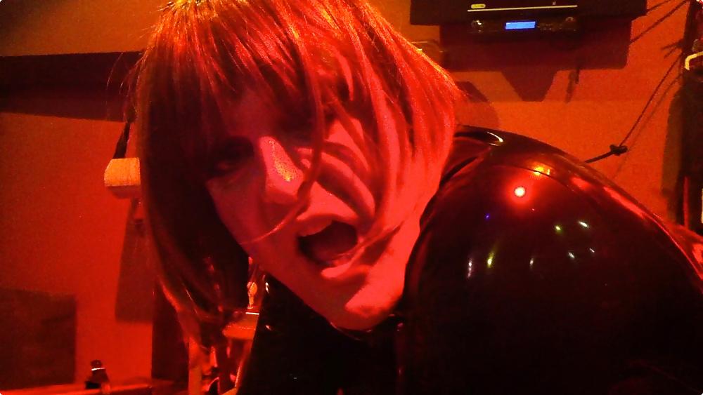 25P Transvestite latex slut enjoys a strapon in both holes