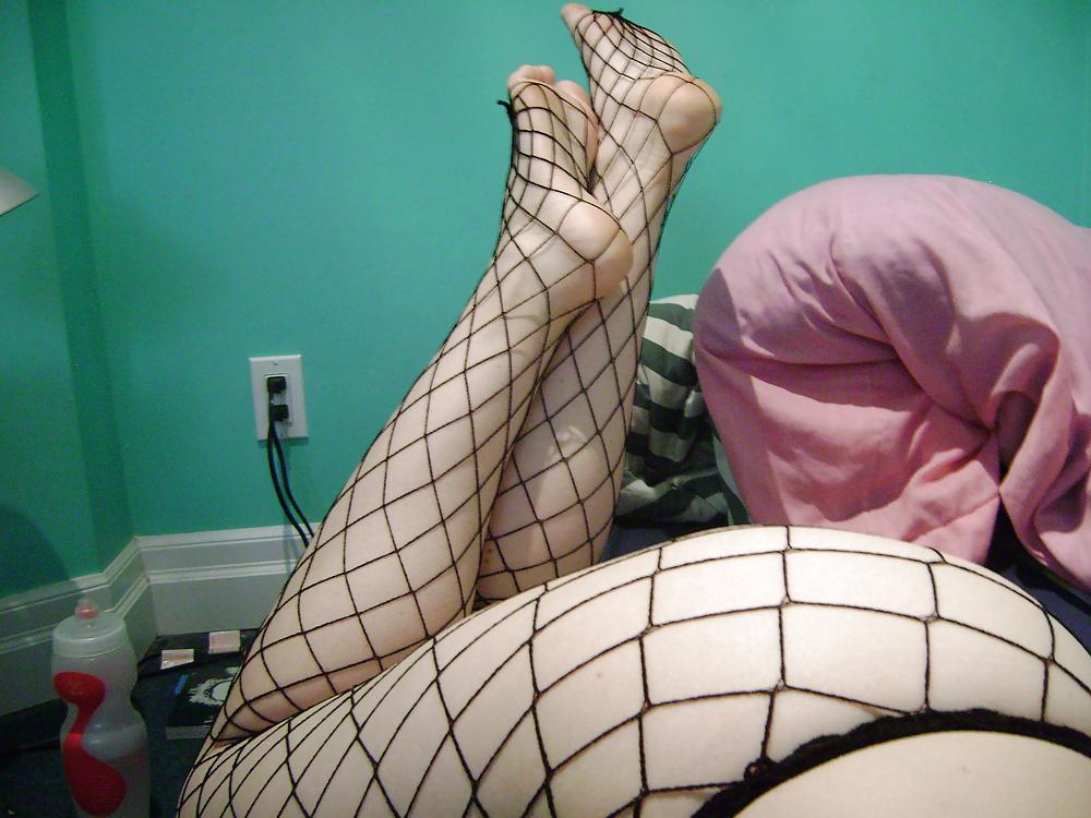 16P Girl wearing fishnet stockings