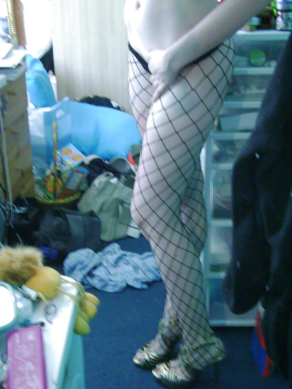 16P Girl wearing fishnet stockings