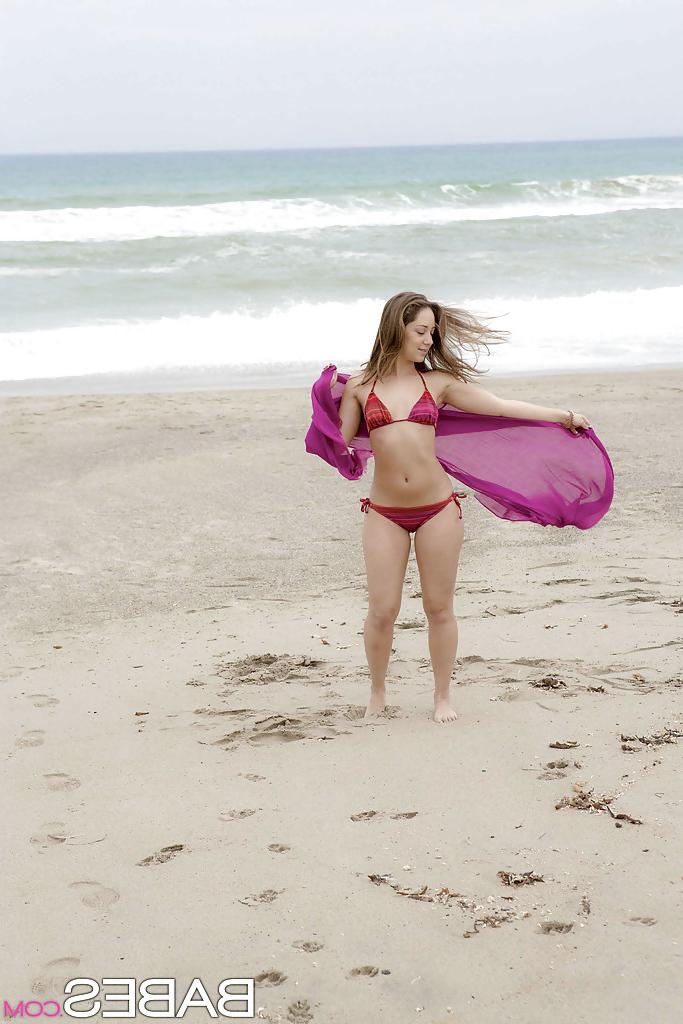 12P Amazing wet babe Remi showing that beautiful body on the beach