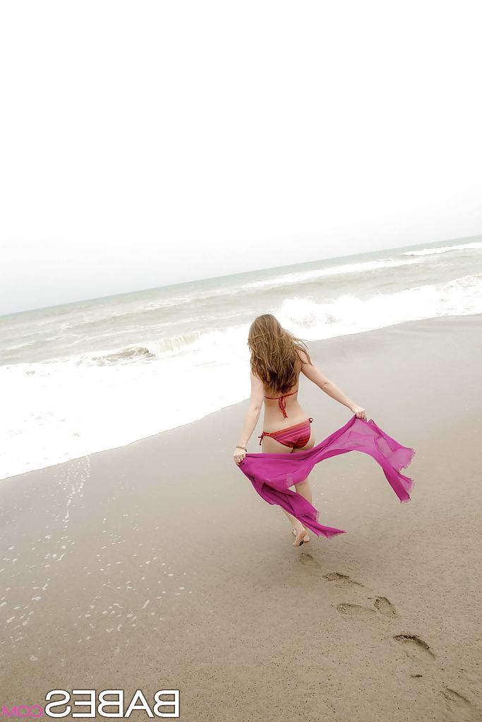12P Amazing wet babe Remi showing that beautiful body on the beach
