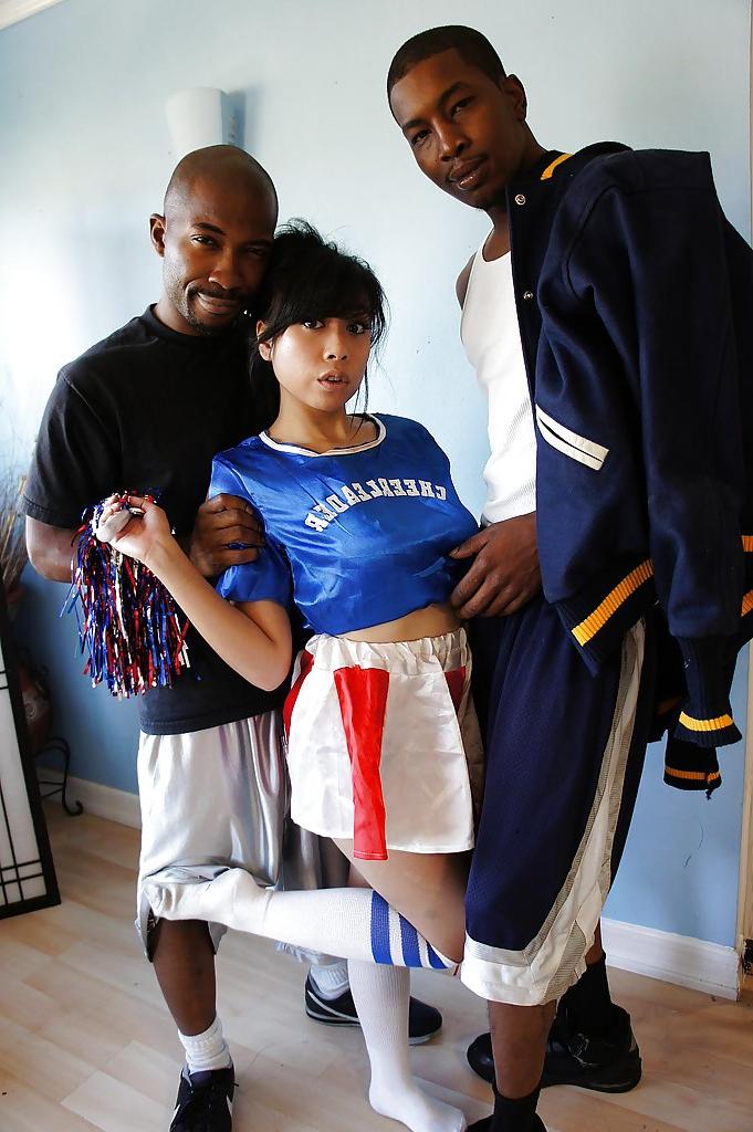 16P Awesome asian cheerleader May gets banged by these two black cocks