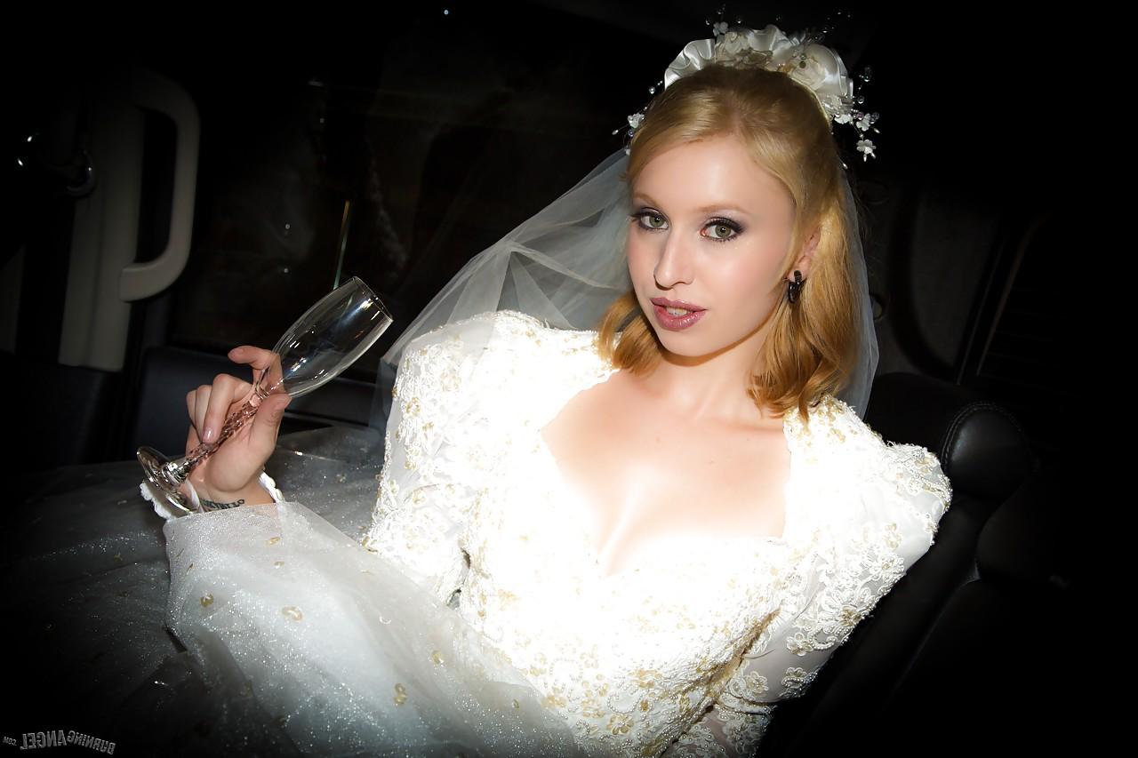 15P Blonde Eidyia tongues bbc & gets cum on tits in interracial wedding fuck