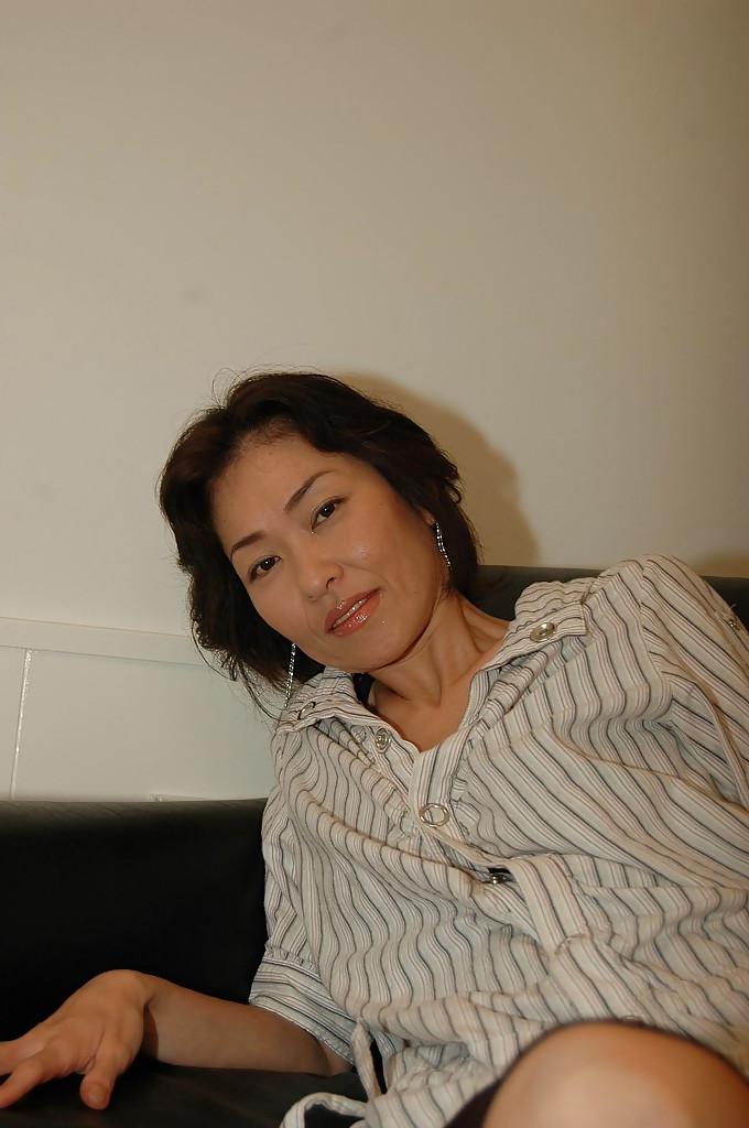 16P Naughty asian MILF takes off her skirt and has some pussy vibing fun