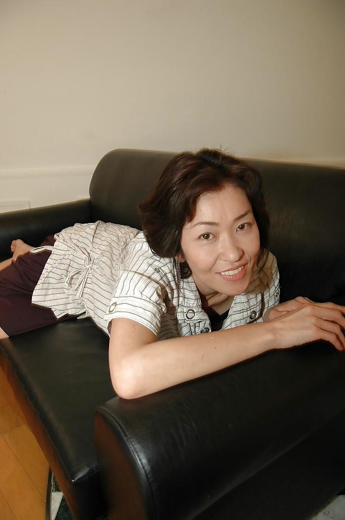 16P Naughty asian MILF takes off her skirt and has some pussy vibing fun