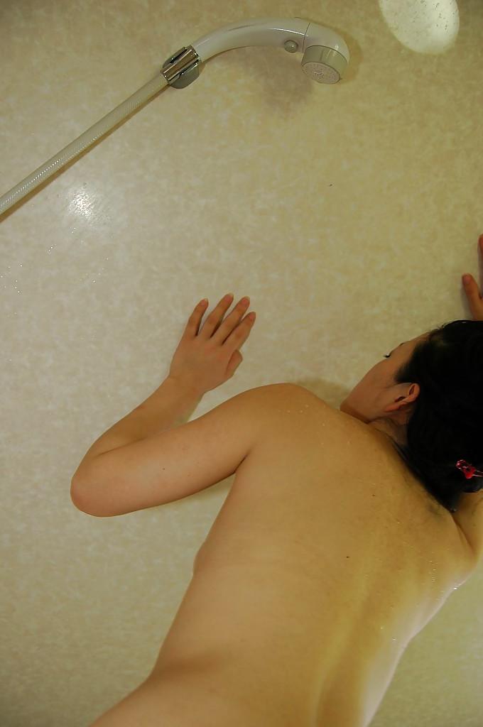 16P Asian MILF gives a sensual hand and blowjob and gets fucked doggy-style