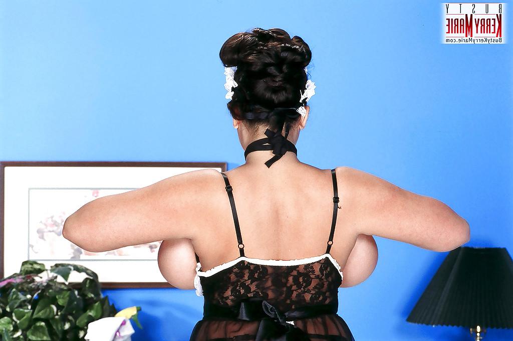 16P Plump Latina pornstar Kerry Marie touting massive boobs in maid outfit