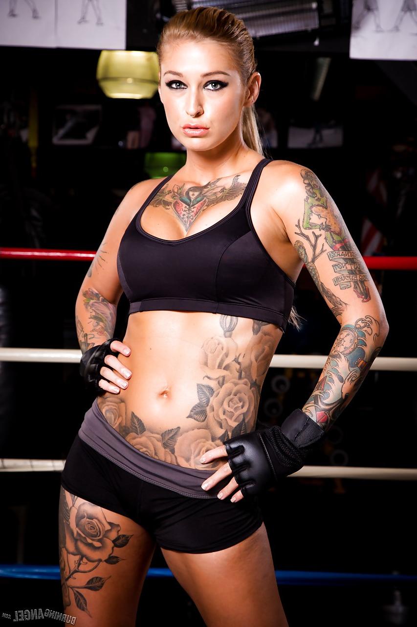 15P Tattooed MILF pornstar Kleio Valentien in shorts showing big tits in gym