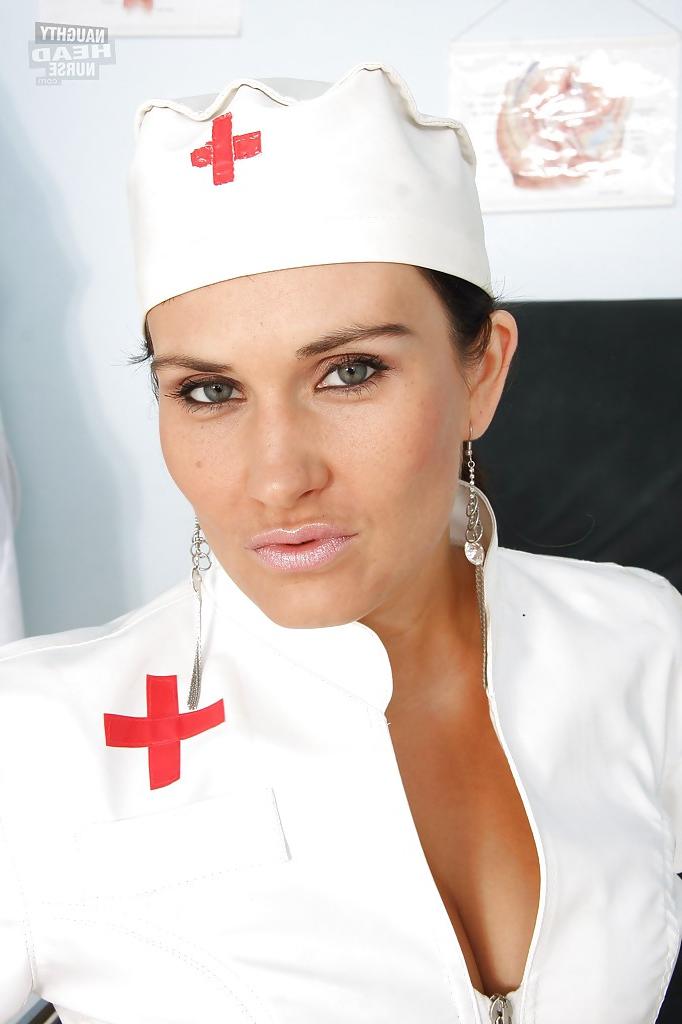 16P Petite vixen in nurse uniform stripping and spreading her legs