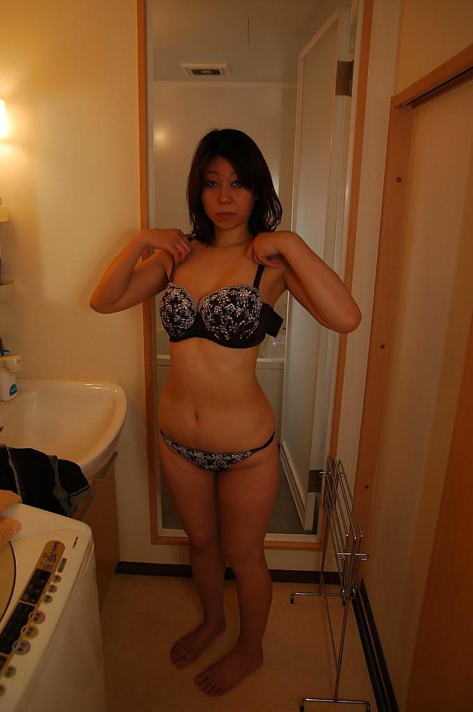 16P Asian MILF Haruko Ogura strips down and gets fucked tough after shower