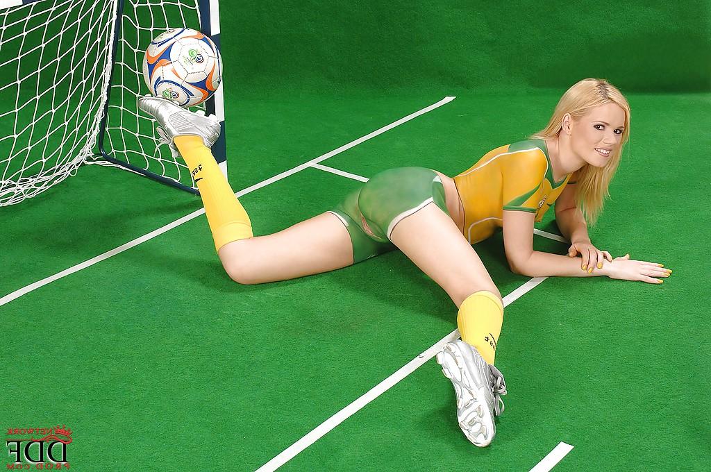 16P Yasmine Gold exposes her sexy curves covered with body painted sport uniform