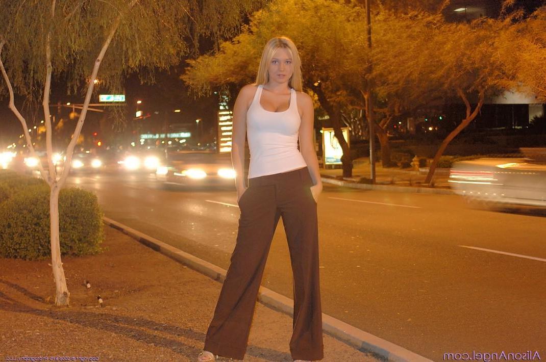 20P Pictures of teen amateur Alison Angel using the ATM topless