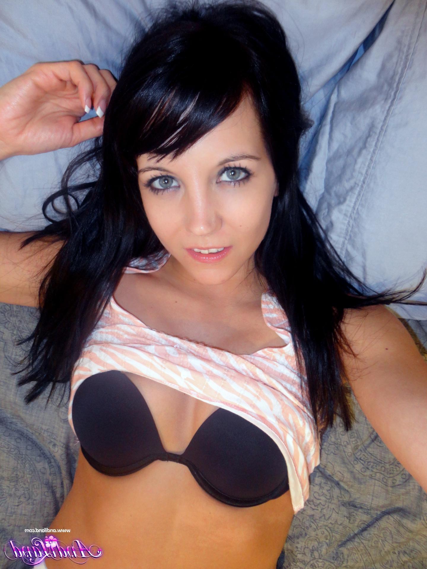 15P Pictures of Andi Land pulling down her white pants in bed