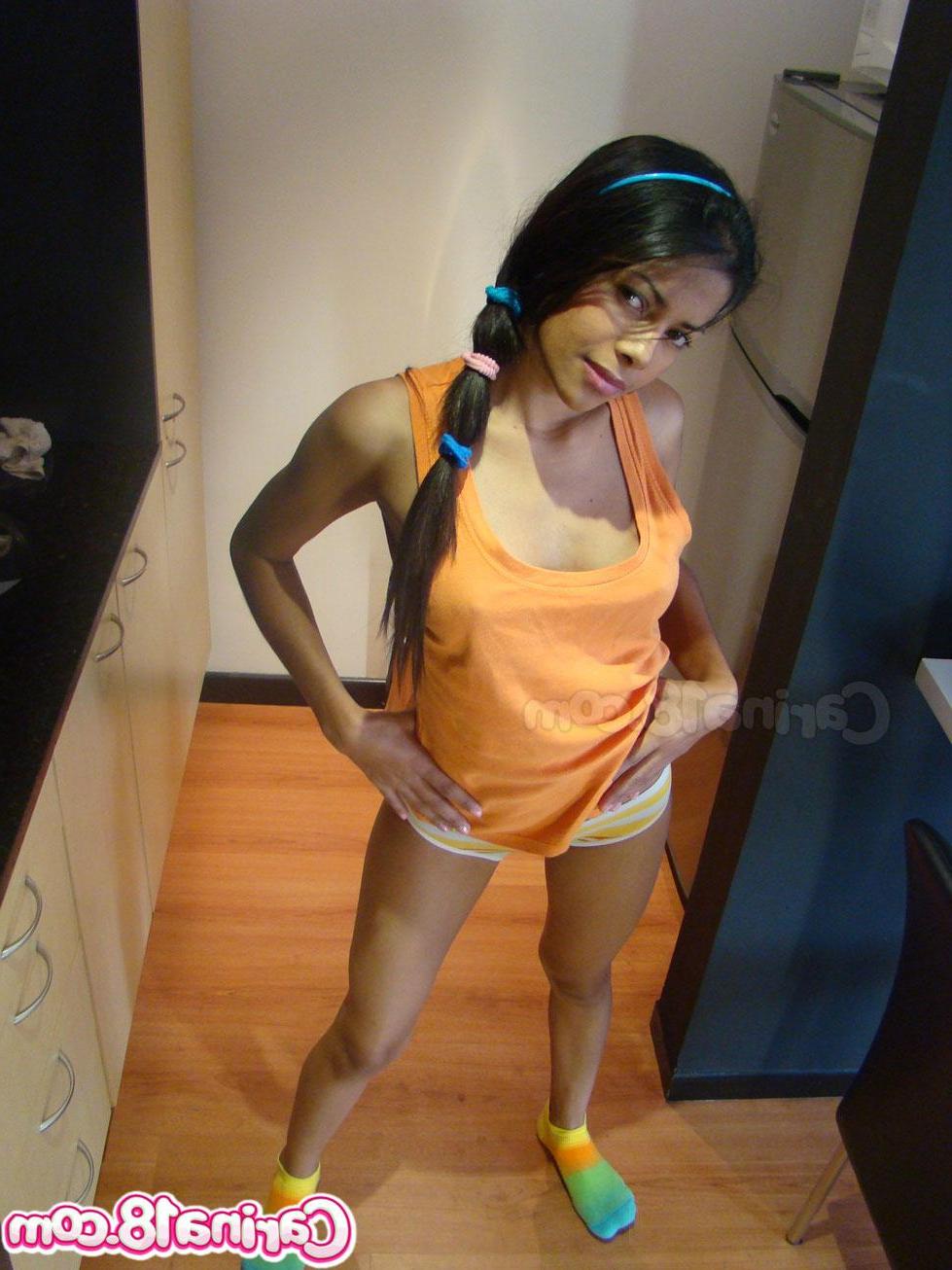12P Cute latin teen Carina 18 strips down to her socks for you
