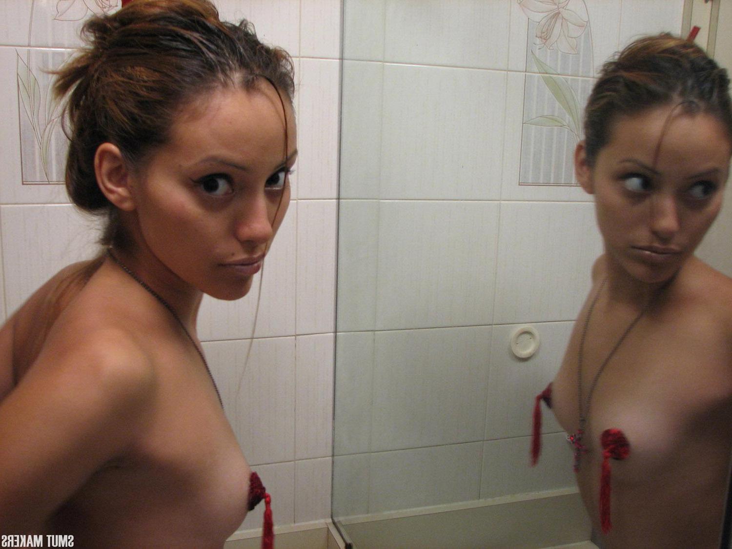 15P Latin girl Elina puts on some pasties and teases in front of the mirror