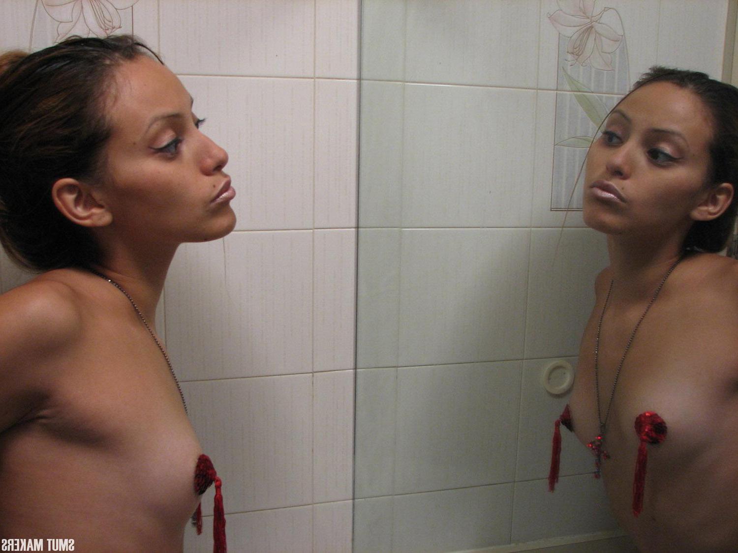 15P Latin girl Elina puts on some pasties and teases in front of the mirror
