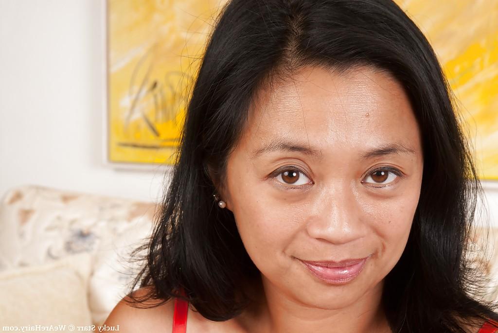 16P Filthy asian MILF Lucky Starr slipping off her dress and panties