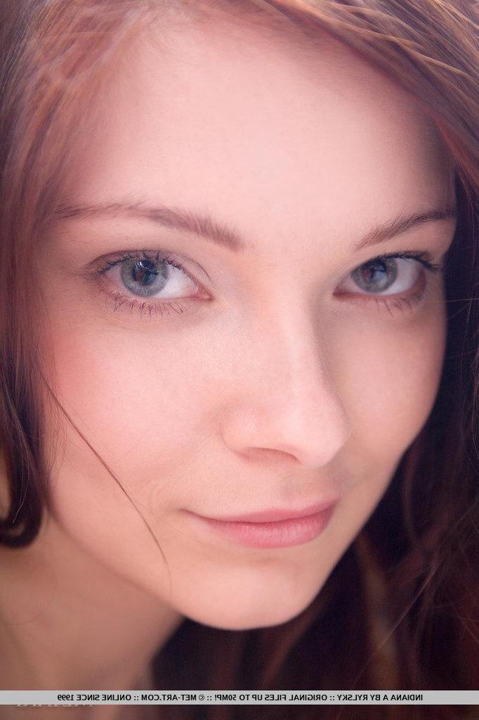 18P Pictures of gorgeous redhead Indiana A stripping out of her black lingerie
