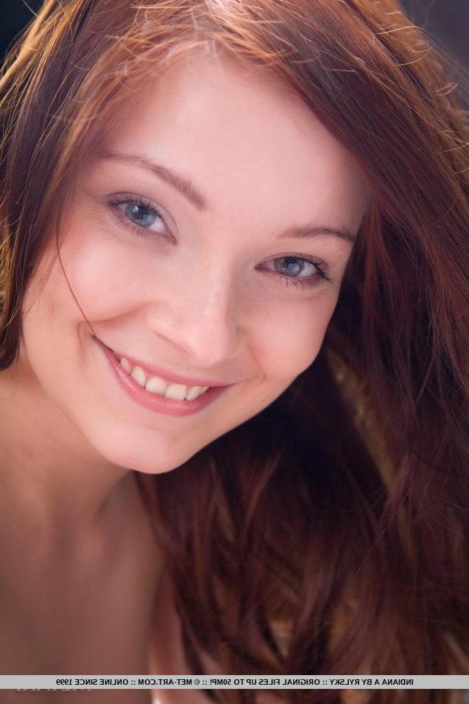 18P Pictures of gorgeous redhead Indiana A stripping out of her black lingerie