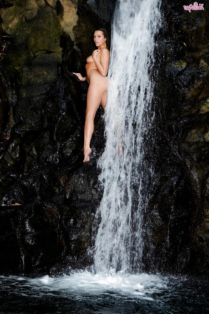 16P Leggy pornstar babe Mia Malkova gets wet standing near a waterfall