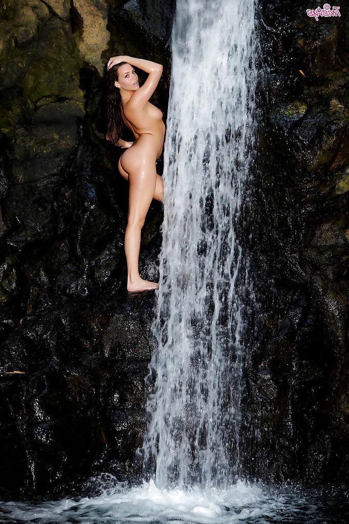 16P Leggy pornstar babe Mia Malkova gets wet standing near a waterfall
