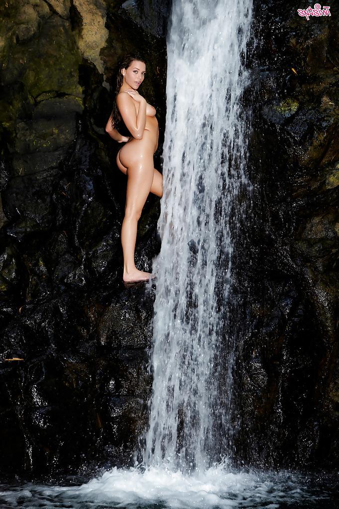 16P Leggy pornstar babe Mia Malkova gets wet standing near a waterfall