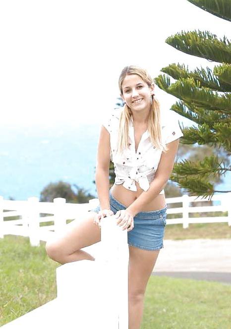 16P Blond teen strips infront of a fence for cows
