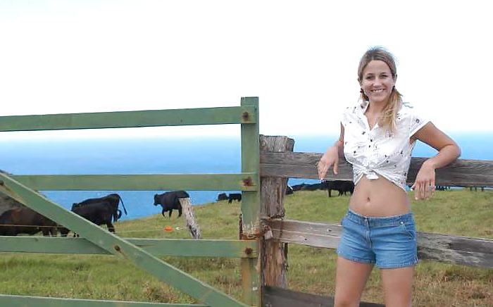 16P Blond teen strips infront of a fence for cows