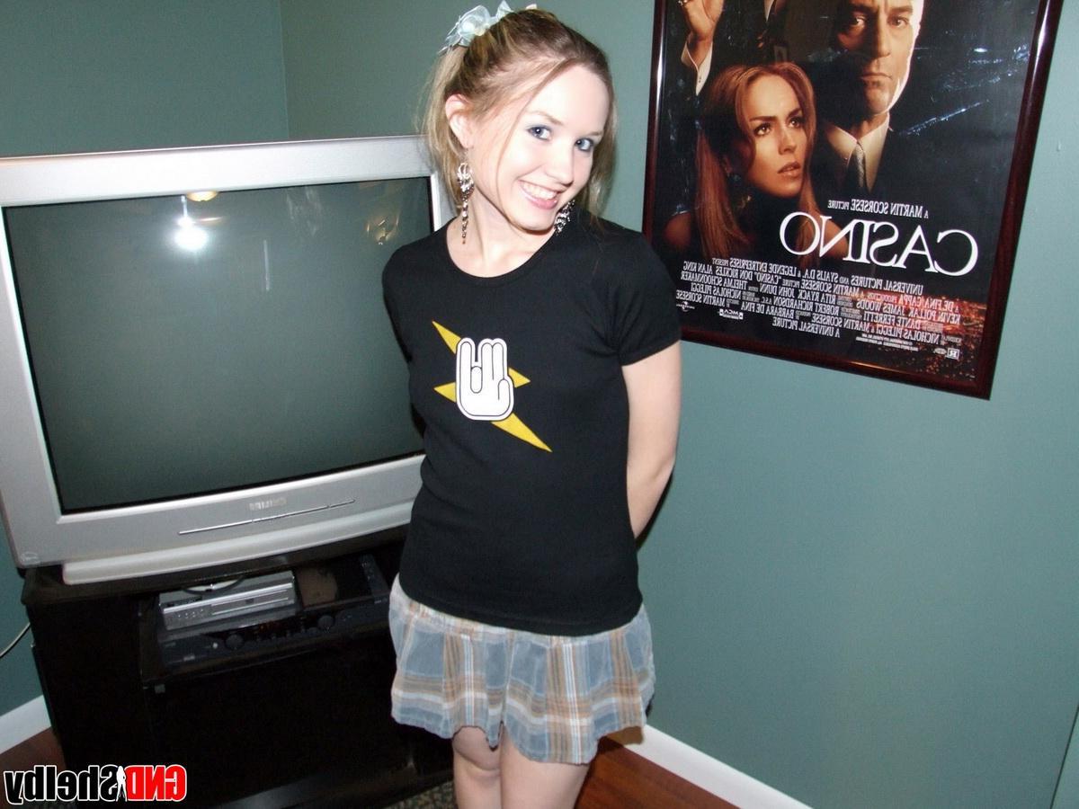 12P Cute teen Shelby shows off her perky tits as she strips naked and rubs her wet pussy