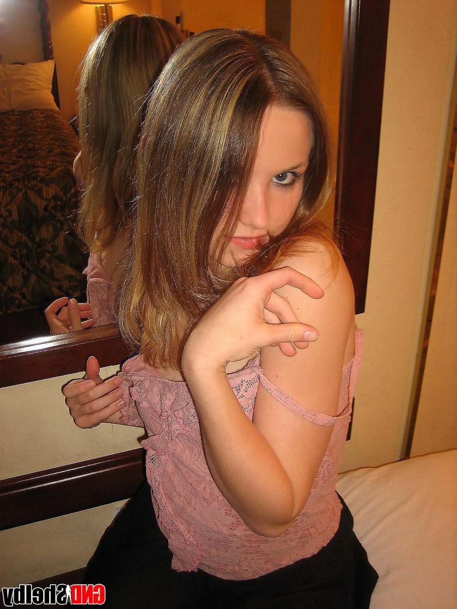 12P Petite teen Shelby strips naked in front of her hotel mirror and begins to finger her tight little pussy