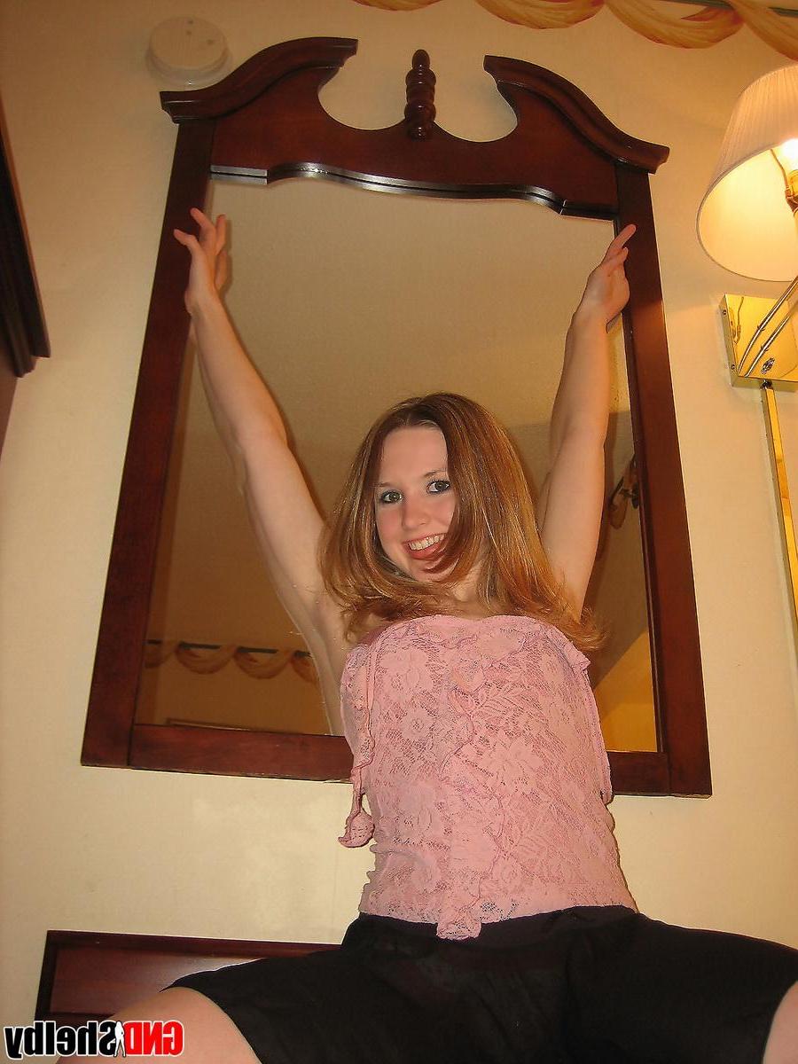 12P Petite teen Shelby strips naked in front of her hotel mirror and begins to finger her tight little pussy