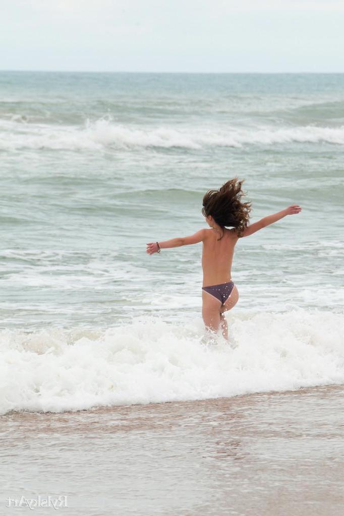 16P Pictures of hot teen girl Nedda enjoying her nakedness on a beach