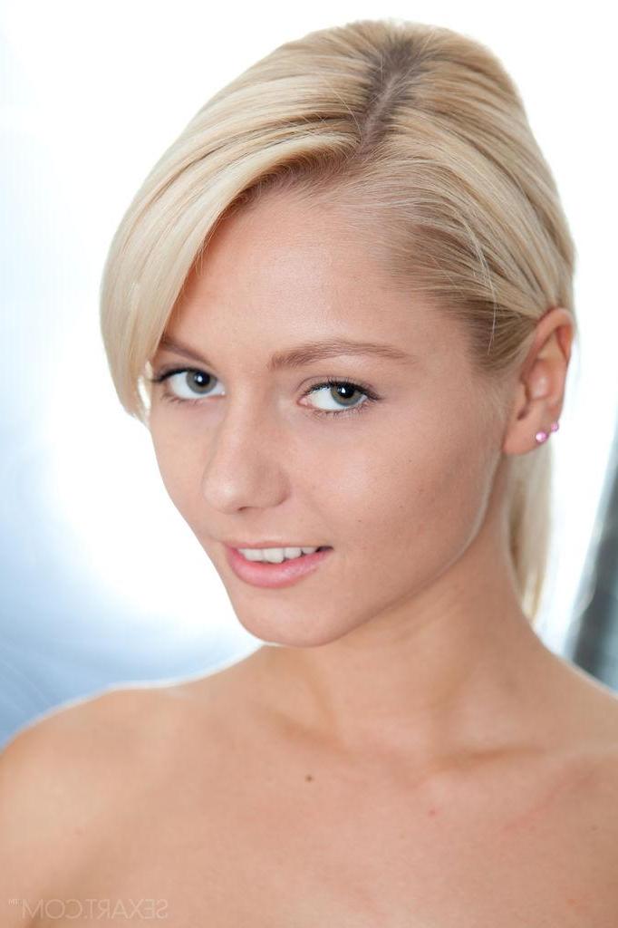 12P Beautiful blonde teen Grace C displays the look of an innocent blond nubile
