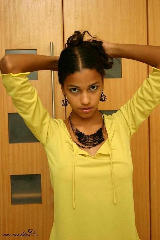 16P Pictures of latin teen Polliana teasing in a yellow shirt