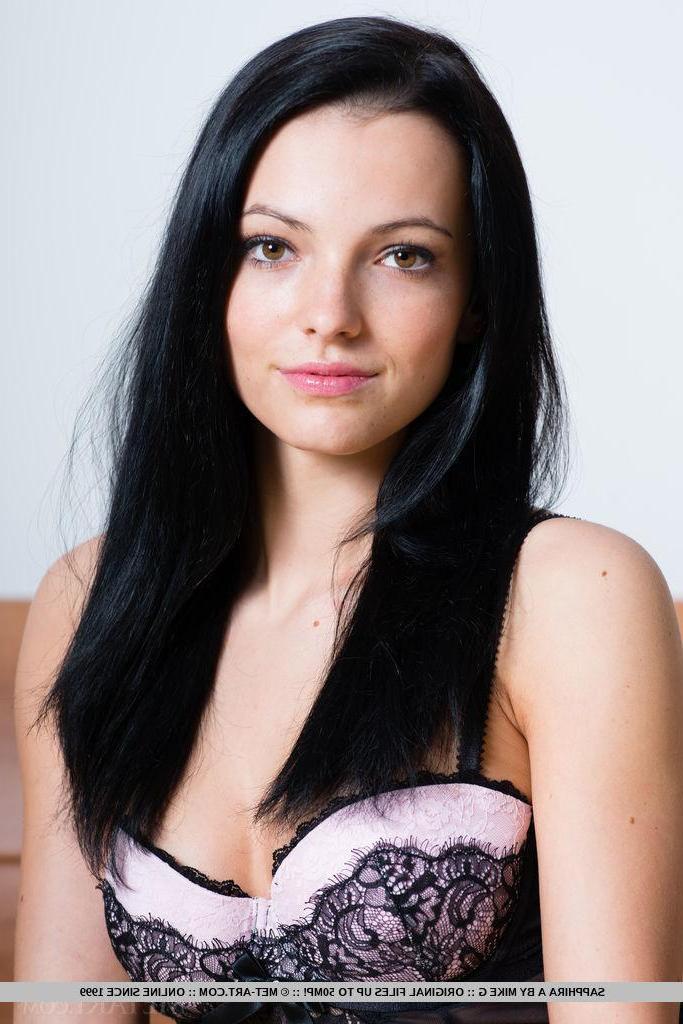 18P Pretty brunette Sapphira A spreads her legs in black stockings