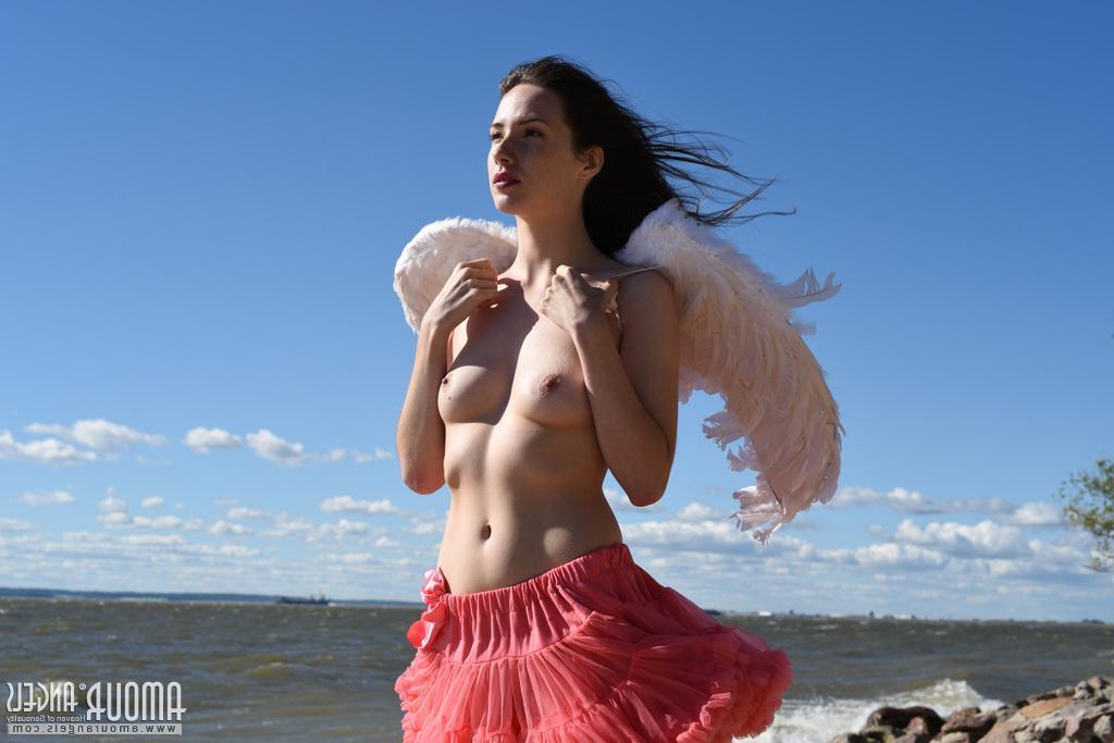 20P Brunette teen Dama spreads her wings and legs outside